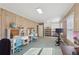 Spacious office with wood paneling, built-in shelving, two desks, and ample lighting at 3902 Sheldon Ne Dr, Atlanta, GA 30342