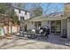Comfortable outdoor patio with stylish seating, barbecue, and a view of the backyard at 3902 Sheldon Ne Dr, Atlanta, GA 30342