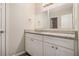 Bathroom vanity featuring white cabinets, granite countertop, and a large mirror at 4260 Mason Creek Rd, Winston, GA 30187