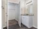Bathroom with an open closet and granite countertops at 4260 Mason Creek Rd, Winston, GA 30187