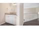 Bathroom vanity featuring white cabinets, granite countertop, and modern fixtures at 4260 Mason Creek Rd, Winston, GA 30187