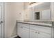Bathroom vanity featuring white cabinets, granite countertop, and a large mirror at 4260 Mason Creek Rd, Winston, GA 30187
