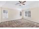 Spacious bedroom featuring high ceilings, carpet, and plenty of natural light at 4260 Mason Creek Rd, Winston, GA 30187
