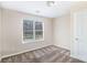 Cozy bedroom featuring soft carpet, neutral walls, and a bright window at 4260 Mason Creek Rd, Winston, GA 30187