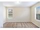 Well-lit bedroom with neutral decor, carpet, and double windows providing ample light at 4260 Mason Creek Rd, Winston, GA 30187