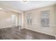 Open-concept living room featuring hardwood floors, neutral paint colors, and natural light at 4260 Mason Creek Rd, Winston, GA 30187