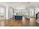 Open-concept living area featuring beautiful hardwood floors and abundant natural light at 175 Basil St, Cumming, GA 30040