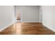 Spacious living room showcasing natural light, hardwood flooring, and neutral-colored walls at 175 Basil St, Cumming, GA 30040