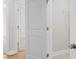 View down a bright hallway, showcasing doorways to rooms and a clean, modern aesthetic at 175 Basil St, Cumming, GA 30040