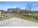 A spacious wood deck overlooking a grassy yard and trees at 3165 Pucketts Mill Rd, Buford, GA 30519