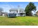 Beautiful backyard featuring a deck, a yard with a trampoline, mature landscaping, and a privacy fence at 3165 Pucketts Mill Rd, Buford, GA 30519