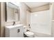 Cozy bathroom featuring a tub and shower combo, modern vanity with white countertop, and decorative mirror at 3165 Pucketts Mill Rd, Buford, GA 30519