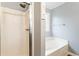 Clean and bright bathroom with a tub and shower at 3165 Pucketts Mill Rd, Buford, GA 30519