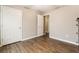 A bedroom featuring hardwood floors, closet and an ensuite at 3165 Pucketts Mill Rd, Buford, GA 30519