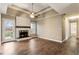 Spacious living room with a stone fireplace, wood floors, and natural light from a glass door at 3165 Pucketts Mill Rd, Buford, GA 30519