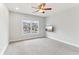 Bright bedroom with ceiling fan and natural light coming through the large window at 3468 Pine Grove Dr, Douglasville, GA 30135