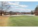 Golf course with a lake in the background and the flag in the foreground at 3468 Pine Grove Dr, Douglasville, GA 30135