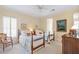 Bedroom featuring two twin beds, neutral walls and carpet, and classic wood furniture at 4610 Wynmeade Ne Park, Marietta, GA 30067