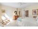 Bedroom featuring four poster bed, rocker, and patterned quilt at 4610 Wynmeade Ne Park, Marietta, GA 30067