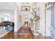 Elegant foyer featuring a curved staircase, hardwood floors, and grand entrance hall at 4610 Wynmeade Ne Park, Marietta, GA 30067