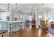 Open-concept kitchen with a center island, modern appliances, and stylish wallpaper at 4610 Wynmeade Ne Park, Marietta, GA 30067