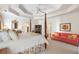 Open main bedroom with tray ceilings, four-poster bed, and a comfortable sitting area at 4610 Wynmeade Ne Park, Marietta, GA 30067