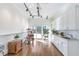 Bright room with white cabinets, track lighting, and a view of the backyard at 4610 Wynmeade Ne Park, Marietta, GA 30067