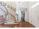 Beautiful staircase with patterned carpet, white railings, and dark wood floors at 4610 Wynmeade Ne Park, Marietta, GA 30067