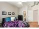 Well lit Bedroom with a full bathroom featuring hardwood floors, ceiling fan, and dresser included at 5300 Peachtree Rd # 1311, Atlanta, GA 30341