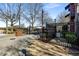 Gated community entrance with a secure wrought iron fence and mature trees lining the perimeter at 5300 Peachtree Rd # 1311, Atlanta, GA 30341