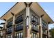 A multi-story building with a mix of retail and residential spaces, showcasing modern architecture at 5300 Peachtree Rd # 1311, Atlanta, GA 30341