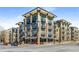 Modern apartment building featuring stylish architecture, multiple balconies, and street-level commercial spaces at 5300 Peachtree Rd # 1311, Atlanta, GA 30341