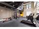 Well-equipped gym area with modern machines, free weights, a mirrored wall, and a mezzanine level at 5300 Peachtree Rd # 1311, Atlanta, GA 30341