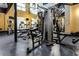 Gym area showcasing an array of exercise equipment, mirrored walls, and ample space for a comprehensive workout at 5300 Peachtree Rd # 1311, Atlanta, GA 30341