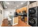 Modern kitchen with stainless appliances, wooden cabinets, kitchen island, and a stackable washer and dryer at 5300 Peachtree Rd # 1311, Atlanta, GA 30341