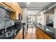 Well-lit kitchen with stainless steel appliances, dark countertops, and an open layout to the living area at 5300 Peachtree Rd # 1311, Atlanta, GA 30341