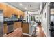 Modern kitchen with stainless steel appliances, granite countertops, island with seating and hardwood floors at 5300 Peachtree Rd # 1311, Atlanta, GA 30341
