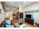 Living room featuring hardwood floors, modern furniture, kitchen, and stainless steel appliances at 5300 Peachtree Rd # 1311, Atlanta, GA 30341