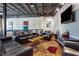 Stylish living room with comfortable leather seating, a patterned rug, sleek entertainment center, and contemporary artwork at 5300 Peachtree Rd # 1311, Atlanta, GA 30341