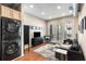 Bright living room featuring hardwood floors, modern furniture, and natural light from the double french doors at 5300 Peachtree Rd # 1311, Atlanta, GA 30341
