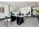 Bright office space with a large glass desk, multiple work stations, neutral tones, and natural light from the window at 5300 Peachtree Rd # 1311, Atlanta, GA 30341