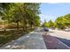 Scenic street view with mature trees lining the sidewalk, offering a pleasant environment at 5300 Peachtree Rd # 1311, Atlanta, GA 30341