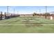 Tennis court located on rooftop; fence and lighting is present at 5300 Peachtree Rd # 1311, Atlanta, GA 30341