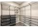 Well-organized walk-in closet with metal racks, shelves, drawers and hanging space for optimal storage at 5300 Peachtree Rd # 1311, Atlanta, GA 30341