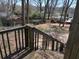 View from a wood back deck looking out over the backyard and surrounding trees at 542 Sugar Hill Nw Dr, Marietta, GA 30060