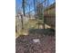 Backyard with foliage and an elevated deck attached to the home and a wood fence at 542 Sugar Hill Nw Dr, Marietta, GA 30060