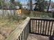 A view of the backyard from the deck of the house overlooking mature trees at 542 Sugar Hill Nw Dr, Marietta, GA 30060