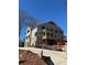 New construction home with a combination of brick and siding with multiple balconies at 542 Sugar Hill Nw Dr, Marietta, GA 30060