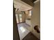 Incomplete laundry area featuring double doors, tile floors, and a utility sink with white cabinets at 542 Sugar Hill Nw Dr, Marietta, GA 30060