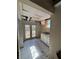 Incomplete laundry area featuring double doors, tile floors, and a utility sink with white cabinets at 542 Sugar Hill Nw Dr, Marietta, GA 30060
